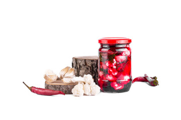 Cauliflower pickle with beetroot, marinated cauliflower pickle in jars with pepper and garlic on...