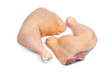 Raw chicken leg quarters on white isolated background.