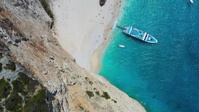 View of Navagio beach, Zakynthos Island, Greece. Aerial landscape. Azure sea water. Rocks and sea. Summer landscape from the air.