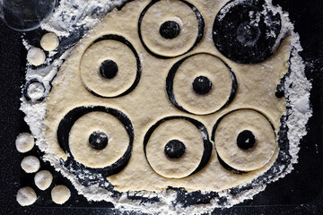 Rolled out dough. Cut out circles for making cottage cheese donuts, pies.