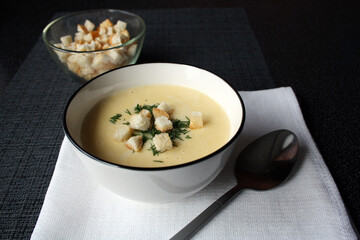 Cheese soup in a white bowl.