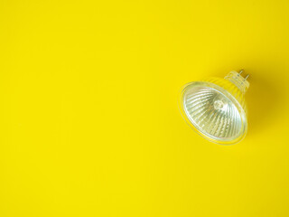 halogen lamp on yellow background with space for text