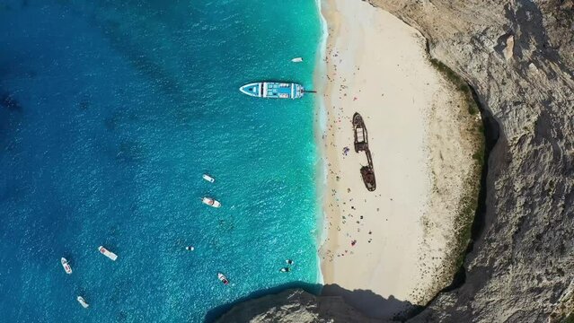 View of Navagio beach, Zakynthos Island, Greece. Aerial landscape. Azure sea water. Rocks and sea. Summer landscape from the air.