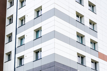 Fototapeta premium fragment of the facade of a renovated and thermally insulated multi-storey apartment house