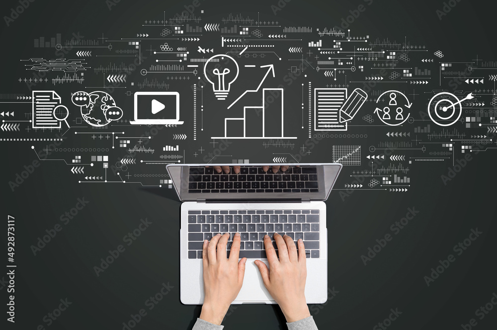 Sticker content marketing concept with person using a laptop computer