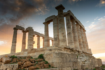 Fototapeta na wymiar The Temple of Poseidon at Cape Sounion at sunset, over the Aegean Sea, Greece