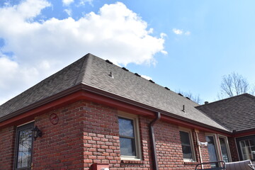 Brick House with Brown Shingles