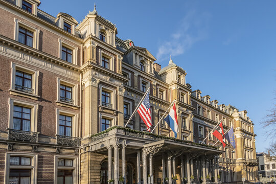 The impressive neoclassical building of the InterContinental Amstel Amsterdam, five-star hotel (55 Rooms, 24 Suites, 1867) on east bank of river Amstel. Amsterdam, The Netherlands. December 13, 2021.