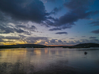 Sunrise and rain clouds waterscape