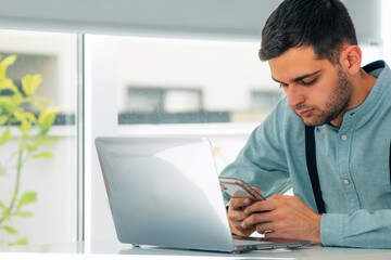 Fototapeta premium businessman with mobile phone or smartphone and computer