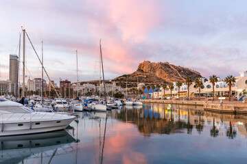 Alicante Port d'Alacant marina with boats and view of castle Castillo evening travel traveling...