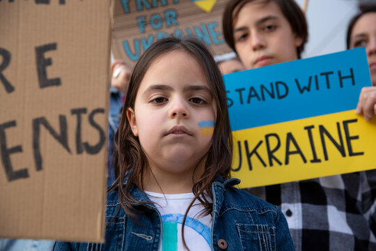 Children at a demonstration in support of Ukrainian people. No to war, activism and human rights movement. - Powered by Adobe