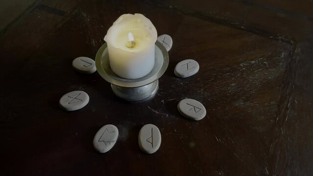Runas Round The Candle on The Table