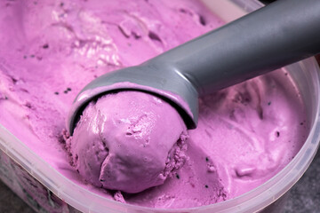 Homemade purple ice cream with ice cream spoon