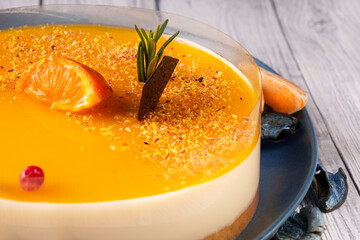 Orange fruit cake on a blue plate