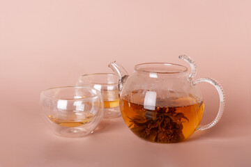 green tea in glass cups and teapot
