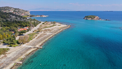 Fototapeta na wymiar Aerial drone photo of small seaside village and small islets of Peristera with crystal clear turquoise sea ideal for quiet vacation close to Athens, Salamina island, Saronic Gulf, Greece