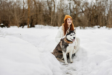 young woman with husky winter walk outdoors friendship Lifestyle