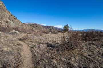path in a mountain desert on a sunny day