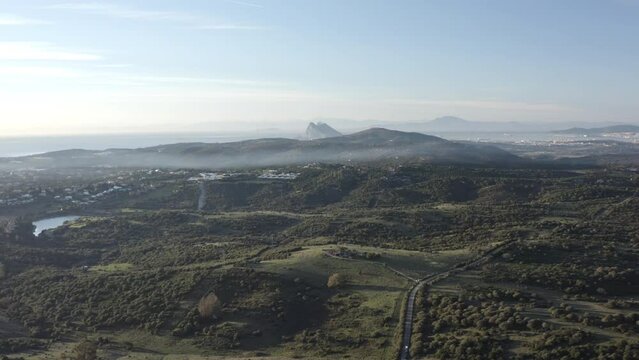 drone flying trvelinng looking a gibraltar rock and the sea spain and morroco