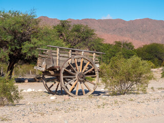 Fototapeta na wymiar Ancient cart on the road between Cachi and Cafayate, Rouite 40, alta Province, Northern Argentina
