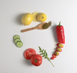 green olives, herbs and vegetable composition with copy space on white background