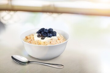 Tasty breakfast Oatmeal porridge in white bowl