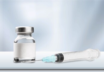 Bottle of Covid-19 vaccine on medical desk