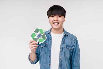 Earth day. Young asian eco-activist holding recycling plastic sign, enviroment protection,...