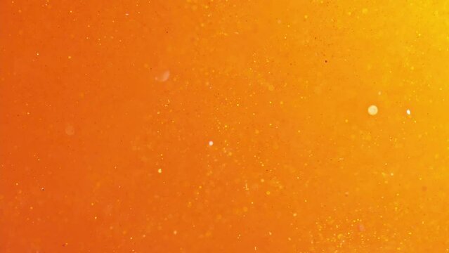 Festive twinkle glitters background video. Abstract glowing backdrop with circles in motion. Footage with liquid twinkling particles. Animation with purple and blue colors with glowing effect.