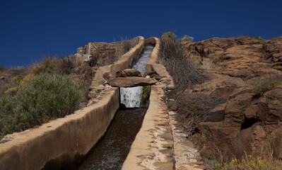 Gran Canaria, landscape of the southern part of the island along Barranco de Arguineguín steep and deep ravine
with vertical rock walls, circular hiking route starting at a hamlet Barranquillo Andres
