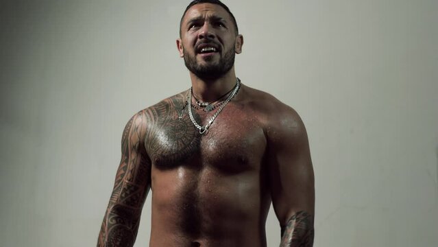 Man emotions faces. Men after exercising. Muscular young man lifting weights. Strong woman working out. Strong sexy fitness man with naked torso in training.