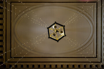 Chandelier with light cables seen from below