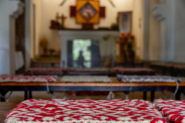 Macro of woven cushion in a small town chapel in Salta, Argentina
