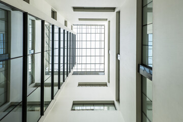 Low angle shot of an atrium of an office building with a glass roof