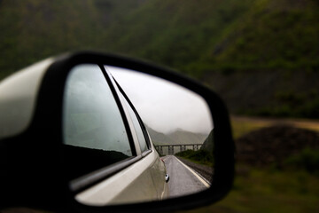 Iron bridge seen through the rearview mirror of a car in Salta, Argentina - Powered by Adobe