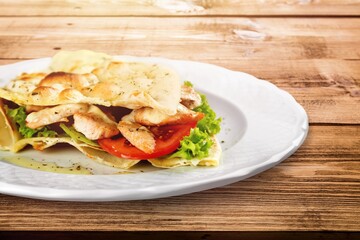Tasty fresh sandwich on wood background white plate