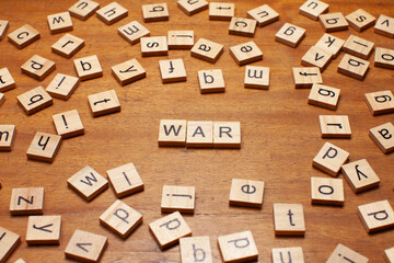 war letters arranged on wooden board