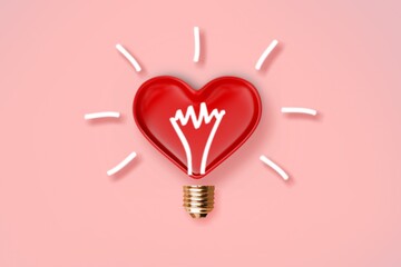 Light bulb icon on red heart. Love, care, sharing, giving, wellbeing, inspiration, and idea...