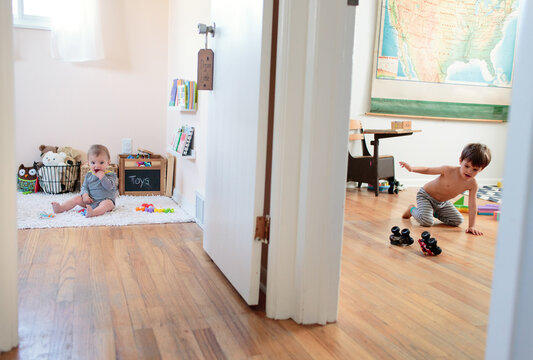 split room view of kids playing