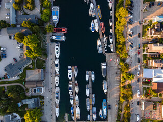 Aerial view of a harbour with boats docked. 