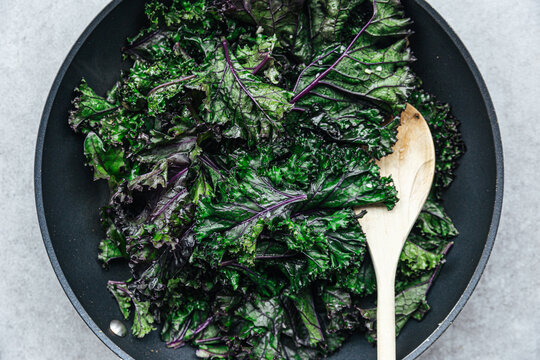 Sauteed kale in a frying pan