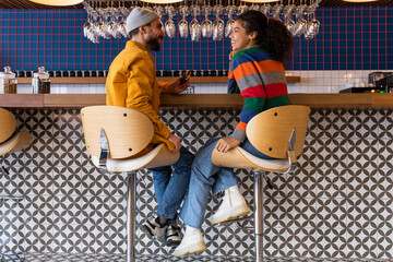 Two friends speaking in cafe