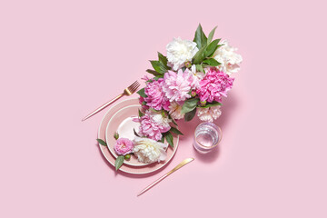 Tableware with blooming peonies on pink background