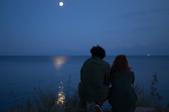silhouette of a couple on the background of the sea