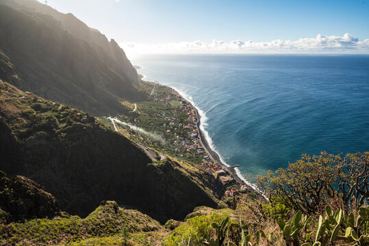 Panoramic view of Paul do Mar and the coast of Madeira near F&atilde;ja da Ovelha, seen from a Miradouro viewpoint at the "Vereda dos Zimbreiros" hiking trail