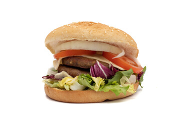 A double meat burger, with the ingredients, lettuce, cabbage, cucumber, tomato, onion, cheese, ketchup, mayonnaise. Isolated on white background. One of the most consumed snacks in the world.