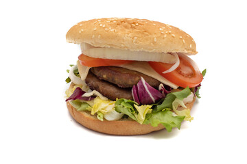 A double meat burger, with the ingredients, lettuce, cabbage, cucumber, tomato, onion, cheese, ketchup, mayonnaise. Isolated on white background. One of the most consumed snacks in the world.