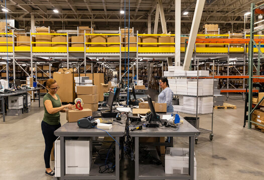 Shipping station at busy ecommerce warehouse