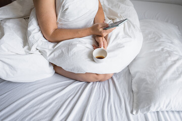 Coffee and morning news in bed